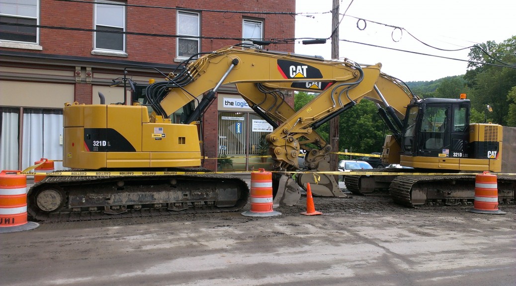 Picture of the big Cat parked in front of the office.